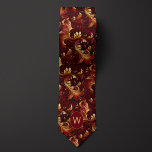 Cravate Monogramme Bourgogne et or<br><div class="desc">Faites une déclaration royale avec notre Cravate Monogramme Bourgogne et Or. La riche combinaison bordeaux et or respire le luxe et le style. Ne manquez pas l'occasion de l'associer à nos chaussettes assorties pour un ensemble complet.</div>