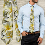 Cravate Yellow Plumeria Flowers Tropical Wedding<br><div class="desc">Yellow plumeria flowers tie for the groom and groomsmen, or wear to a Hawaiian wedding. A full pattern of frangipani blossoms with buds in white, yellow and green colors covers this necktie. Each open flower is golden yellow at the center fading to white at the edges. The fun, bold, floral...</div>