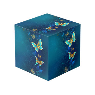Cube Photo Papillons d'or sur un Arrière - plan bleu