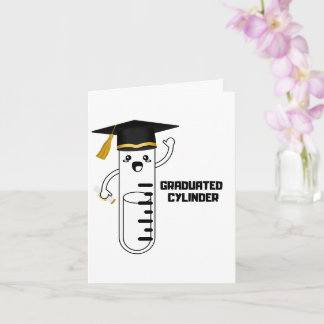Cylindre gradué, carte de voeux pliée sur la scien