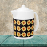 Dahlia jaune motif floral sur noir<br><div class="desc">Théière en céramique blanche avec couvercle qui présente l'image d'une fleur Dahlia jaune sur un arrière - plan noir et imprimé dans un motif extensible. Un design floral et amusant !</div>