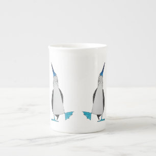 Danse de la tasse aux pieds bleue de porcelaine