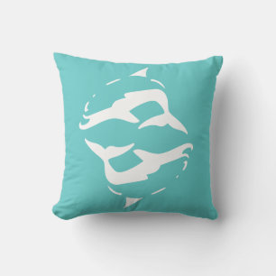 dauphins blancs sur un oreiller bleu sarcelle