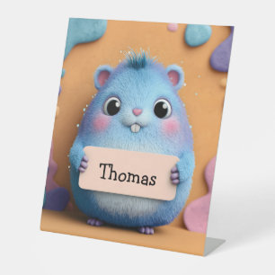 De Table Hamster bleu bouffant tenant un signe avec nom