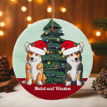Décoration En Céramique Deux Corgi Tricolore Rouge Blanc Père Noël<br><div class="desc">Ce magnifique ornement de chien de Pembroke Welsh Corgi comprend deux chiens portant des casquettes du Père Noël avec une adorable inclinaison de la tête. Un petit tricolore et un chien rouge et blanc assis devant un joli sapin de Noël orné de décorations colorées. Personnalisez les noms de votre animal...</div>