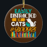 Décoration En Céramique Easily Distracted By Cats And Books Funny Book<br><div class="desc">Easily Distracted By Cats And Books Funny Book Cat Lover Gift. Perfect gift for your dad,  mom,  papa,  men,  women,  friend and family members on Thanksgiving Day,  Christmas Day,  Mothers Day,  Fathers Day,  4th of July,  1776 Independent day,  Veterans Day,  Halloween Day,  Patrick's Day</div>