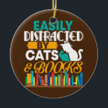 Décoration En Céramique Easily Distracted By Cats And Books Funny Book<br><div class="desc">Easily Distracted By Cats And Books Funny Book Cat Lover Gift. Perfect gift for your dad,  mom,  papa,  men,  women,  friend and family members on Thanksgiving Day,  Christmas Day,  Mothers Day,  Fathers Day,  4th of July,  1776 Independent day,  Veterans Day,  Halloween Day,  Patrick's Day</div>