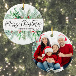 Décoration En Céramique Elegant Botanical Greenery Photo Merry Christmas<br><div class="desc">This simple and classic round Christmas ornament features elegant greenery on the front, including evergreen branches, soft leaves, and subtle pops of red holly berries for a festive touch. In the center, “Merry Christmas” is written in graceful script typography, with space below for your family name or business name. The...</div>