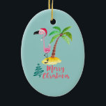 Décoration En Céramique Flamant rose Rose Dans Un Chapeau De Père Noël Par<br><div class="desc">Un ornement de noël à l'ambiance d'île tropicale. Une jolie illustration d'un flamant rose dans un chapeau de santa rouge. À côté d'un palmier vert sur un monticule de sable jaune. Un design d'arbre de Noël tourbillonnant est placé à côté du texte Joyeux Noël. Écrit dans la couleur rose dans...</div>