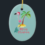 Décoration En Céramique Flamant rose Rose Dans Un Santa Hat Mignonne<br><div class="desc">Un ornement de Noël à l'ambiance insulaire tropicale. Une jolie illustration d'un flamant rose dans un chapeau de Père Noël rouge. À côté d'un palmier vert sur un monticule de sable jaune. Un design tourbillonnant d'arbre de Noël est placé à côté du texte Joyeux Noël. Écrit dans la couleur rose...</div>