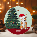 Décoration En Céramique Jote Corgi Santa Hat Arbre de Noël Monogrammé<br><div class="desc">Ce beau chien de Pembroke Welsh Corgi a un mignon casquette du Père Noël et une adorable inclinaison de la tête. Le petit tricolore est assis devant un joli sapin de Noël orné de décorations colorées. Personnalisez le nom de votre animal de compagnie dans une jolie cursive sous le magnifique...</div>