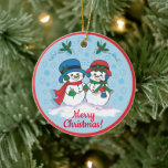 Décoration En Céramique M. & Mme Frosty L'ornement en céramique Snowman<br><div class="desc">Personnalisez cet unique ornement de Noël "One Of A Kind" ! M. & Mme Frosty Le Snowman portant leurs Casquettes de Noël,  les bouffées d'oreilles et les écharpes font une promenade de Noël magique à travers une "Wonderland hivernal enneigé"! Peinture d'art original par l'artiste Kerry Miller.</div>