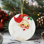 Décoration En Céramique Noël vintage Jolly Santa Claus<br><div class="desc">Ce Jolly Père Noël apportera une ambiance festive et vintage à votre Noël. L'ornement met en vedette un Père Noël aux joues roses dans son casquette rouge et une branche de mistletoe.</div>