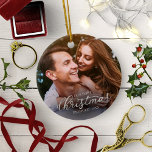 Décoration En Céramique Notre premier script de flocage en argent de Noël<br><div class="desc">Notre premier ornement en céramique de script en argent de Noël</div>
