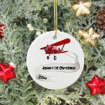 Décoration En Céramique Personnalisé, Avion rouge & Père Noël, Premier Noë<br><div class="desc">Design propose un mignon avion rouge avec Père Noël volant comme pilote. L'avion porte également une bannière portant le nom de votre enfant, le premier Noël et le texte de l'année. Le dos a un texte "Je t'aime". Customisez cette décoration avec vos détails spécifiques. Ce serait parfait pour ce petit...</div>