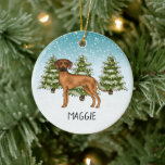 Décoration En Céramique Ridgerhien de Rhodésie nommé Neige Forêt d'Hiver<br><div class="desc">L'illustration de dessin animé originale de Destei d'un chien de race Ridgerhien de Rhodésie mignon. Le chien est placé dans une scène hivernale avec trois sapins verts et de la neige qui tombe. L'arrière-plan est un dégradé de bleu à blanc donnant au design l'apparence d'une journée hivernale froide. Il y...</div>