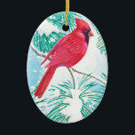 Décoration En Céramique The Cardinal -<br><div class="desc">This ornament features a beautiful red cardinal sitting on a snow covered branch of a pine tree watching the snowflakes coming down from the sky to cover the grounds with a white snow.</div>