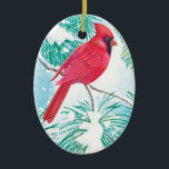 Décoration En Céramique The Cardinal -<br><div class="desc">This ornament features a beautiful red cardinal sitting on a snow covered branch of a pine tree watching the snowflakes coming down from the sky to cover the grounds with a white snow.</div>