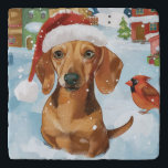 Dessous-de-plat Dachshund Winter Wonderland Christmas Joy<br><div class="desc">Ce design festif reflète l'esprit joyeux de la période des fêtes, avec un adorable petit portant un chapeau de Père Noël. Le chien est niché dans un pays des merveilles hivernales, avec un bonhomme de neige, un sapin de Noël décoré et des cadeaux joliment emballés. Les flocons de neige tombent...</div>