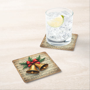 Dessous-de-verre Carré En Papier Cloches de Noël sur une partition de musique,
