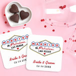 Dessous-de-verre Carré En Papier Marié dans Fabulous Las Vegas Mariage rouge Monogr<br><div class="desc">Custom "Married in Fabulous Las Vegas" wedding beverage coasters feature a monogram of the and groom's names and wedding dates. Black,  red,  blue,  and yellow design colors.</div>