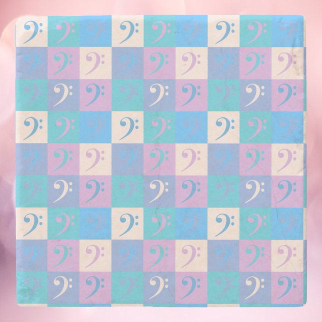 Dessous-de-verre En Pierre Bass Clef Music Motif Pastel (A coaster with a pattern of bass clefs done in yellow, blue, pink and purple.)