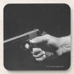 Dessous-de-verre Homme tenant l'arme à feu