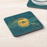 Dessous-de-verre Monogrammed Teal Peacock and Gold Drink<br><div class="desc">Our Monogrammed Cork Coasters coordinate with our Peacock Wedding Collection for a complete and elegant look.  Also a really nice choice to spruce up your home decor or for the office to impress clients.  Matches all our Monogrammed Peacock and Peacock Wedding Collection products.</div>