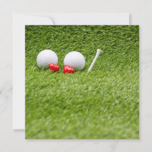 Deux boules de golf avec deux coeurs rouges sur he