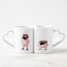 deux oiseaux sur une tasse