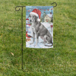 Drapeau De Jardin Greyhound Winter Wonderland Christmas Joie<br><div class="desc">Ce design festif reflète l'esprit joyeux de la période des fêtes, avec un adorable petit portant un chapeau de Père Noël. Le chien est niché dans un pays des merveilles hivernales, avec un bonhomme de neige, un sapin de Noël décoré et des cadeaux joliment emballés. Les flocons de neige tombent...</div>