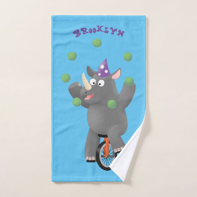 Drôle rhinocéros mignon jonglant sur monocycle (Serviette à main)