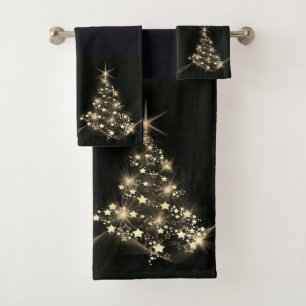 Éclat doré des étoiles sur le sapin de Noël foncé 