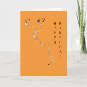 Écouteurs avec la carte de voeux de notes