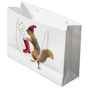 Écureuil avec le sac de cadeau de la botte de