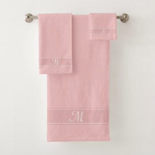 Élégant monogramme sur les tons rose bébé