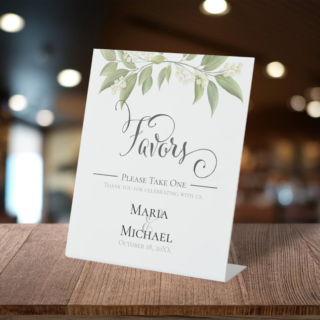 Élégant panneau de cadeaux de mariage à la gouache (Elegant tabletop wedding favors sign with soft watercolor greenery, delicate white florals.)