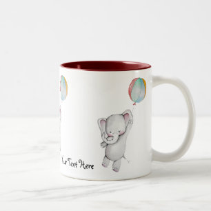 Éléphant de bébé avec la tasse de ballon