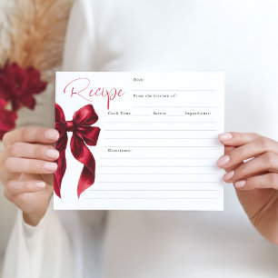 Elle est en train de nouer le noeud Red Bow Bridal