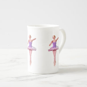 En Porcelaine Ballerine dans la tasse pourpre et blanche de