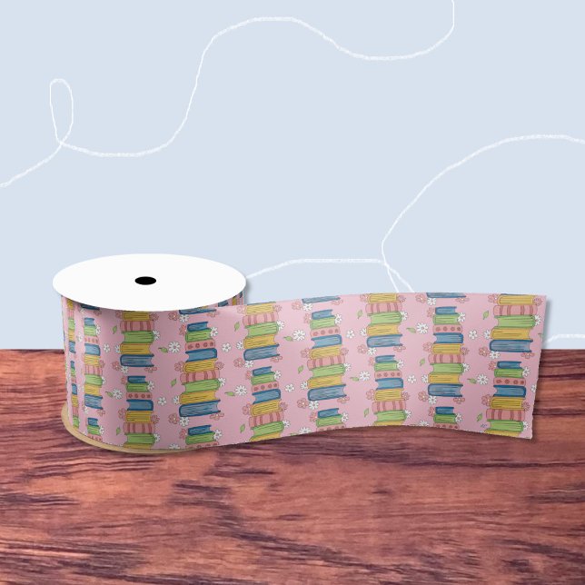 En Satin Ruban rose avec Pile de livres et de petites fleur (Cute pink ribbon for book lovers .)