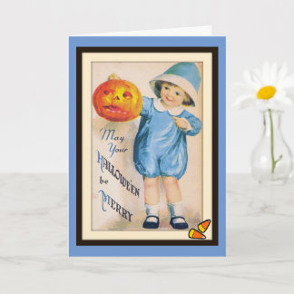 Enfant avec carte de citrouille de Halloween