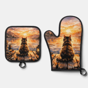 Ensemble De Gant De Cuisine Et De Manique Chat sur le quai au coucher du soleil