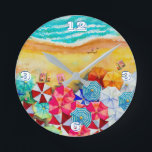 Été Plage Parapluies Horloge Ronde<br><div class="desc">Vagues sur une plage de sable,  bains de soleil sous des parasols colorés,  cette horloge est un ajout amusant à votre maison de plage ou décor d'été ou offrir en cadeau. CORRESPONDRE des articles dans notre magasin.</div>