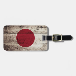 Étiquette À Bagage Drapeau du Japon sur le vieux grain en bois