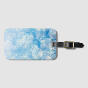 Étiquette À Bagage Flocons de Noël sur un fond bleu        