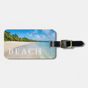 Étiquette À Bagage Marée océanique sur une plage tropicale