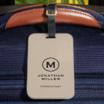 Étiquette À Bagage Monogramme classique noir beige minimal<br><div class="desc">Un design vertical professionnel dans le style moderne avec un emblème en monogramme beige et noir avec une grande typographie classique monogramme initial avec nom et titre ci-dessous. Le texte peut être facilement customisé à l'aide des champs fournis.</div>