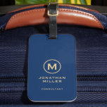 Étiquette À Bagage Monogramme or bleu simple<br><div class="desc">Un design simple et personnalisable avec un emblème en monogramme doré sur arrière - plan bleu.</div>