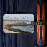 Étiquette À Bagage Morro Bay California Ocean Cliffs Photography<br><div class="desc">A foggy overcast day in Morro Bay California with the ocean waves hitting the rocks on the shore in this beach photograph souvenir. This seaside travel photo luggage tag features black cursive script above the beach rocks and grey sky.</div>